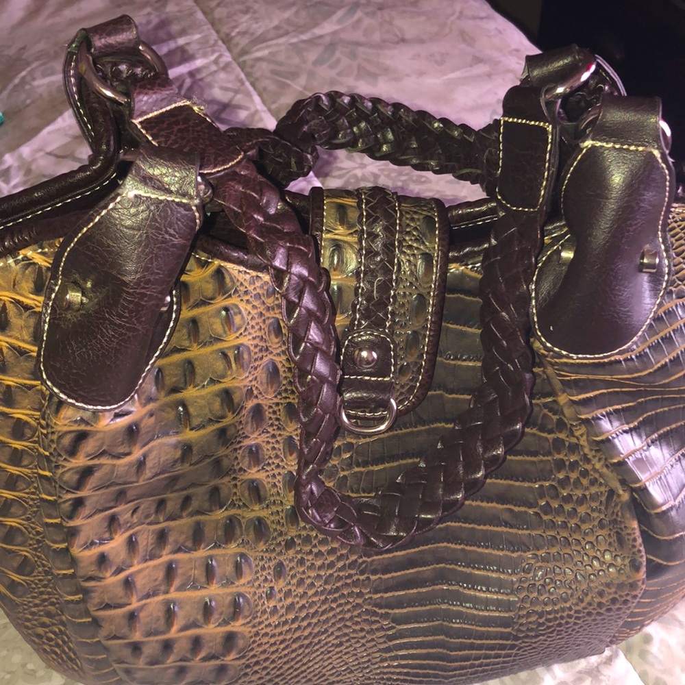 Dark brown and light brown woman’s pocketbook